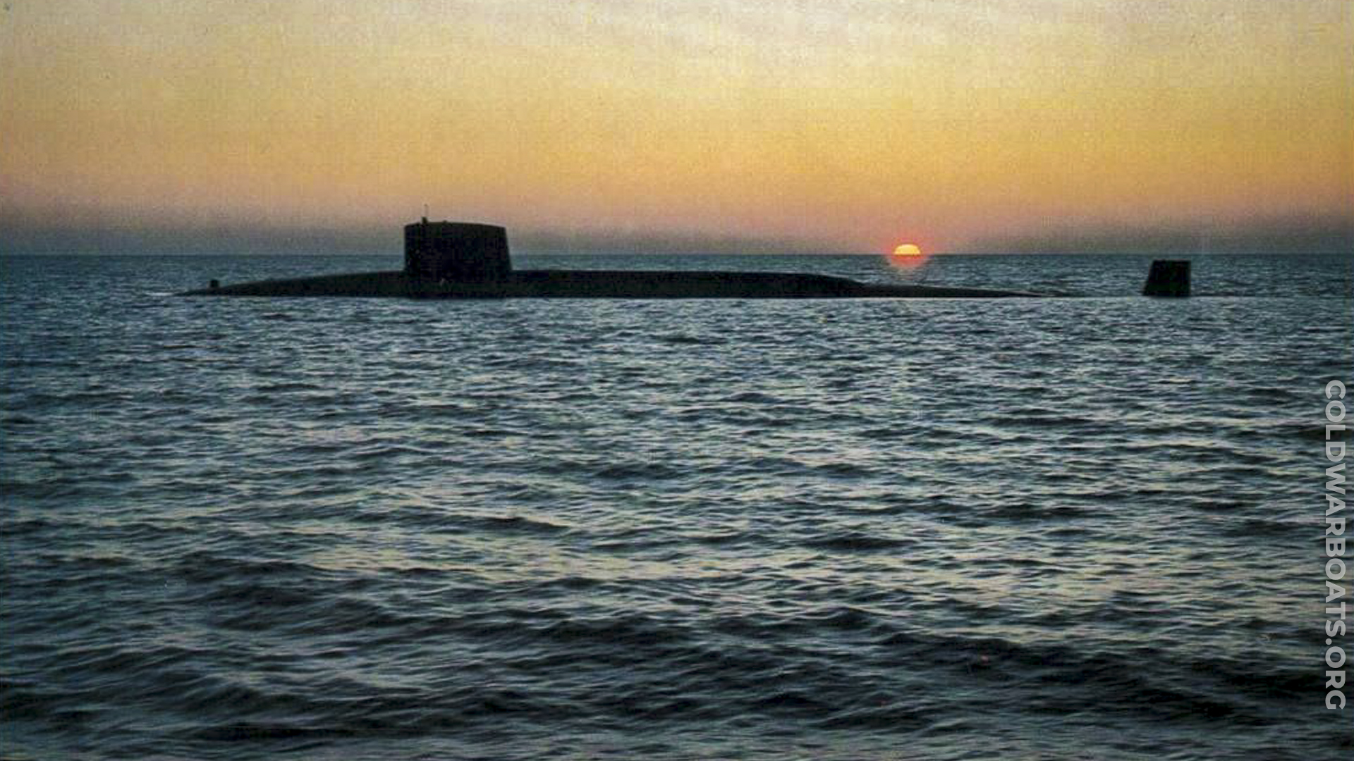 USS LAFAYETTE (SSBN 616) surface transits against the setting sun.
