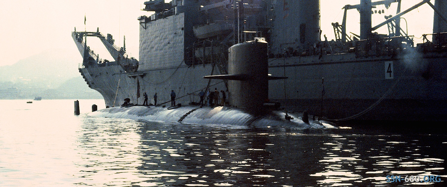 USS WILLIAM H. BATES (SSN 680) tied up to the USS TUSCALOOSA (LST 1187), Sasebo Harbor, Japan, 1982